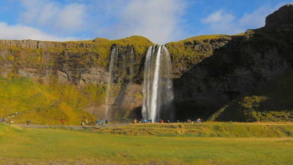 Famous Icelandic Waterfall Seljalandsfoss in Sunny Autumn Day