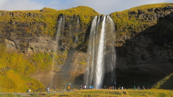 Seljalandsfoss Is One of the Best Known Waterfalls in Iceland, View in Sunny Autumn Day