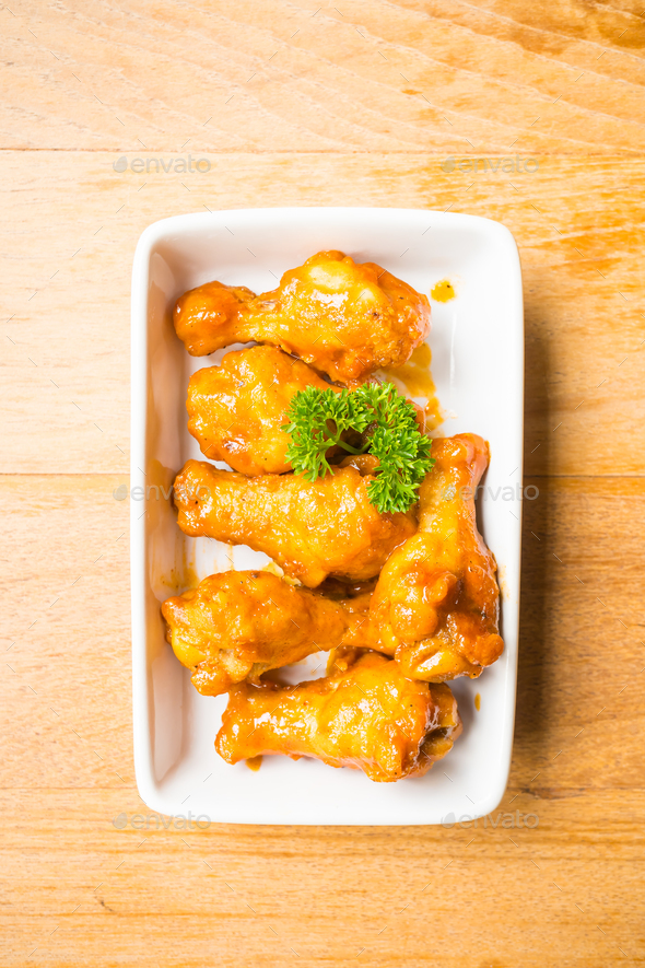 Grilled buffalo wings in white plate - Stock Photo - Images