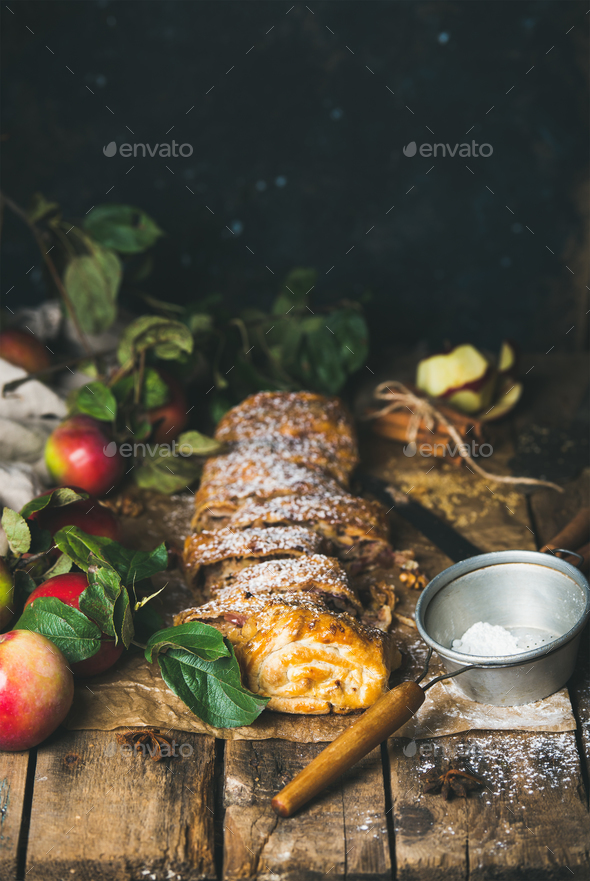 Apple strudel cake with cinnamon, sugar powder and fresh apples - Stock Photo - Images