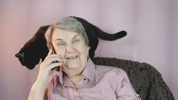 Aged Woman 80s Sitting Next To the Black Cat