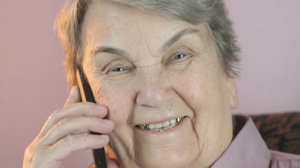 Aged Woman 80s Smiling Talks on the Mobile Phone