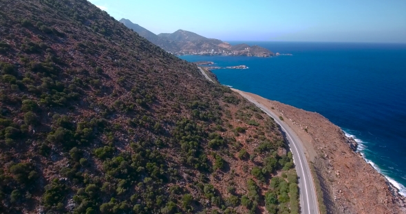 Flying Above Road By Seashore