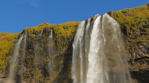 Flow of Icelandic Seljalands River Is Falling Down, Creating Waterfall Seljalandsfoss, Tilt Up