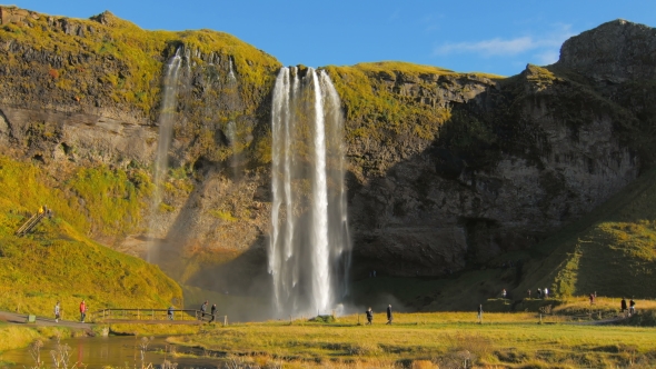 Icelandic Seljalands River and Waterfall Seljalandsfoss in Sunny Autumn Day