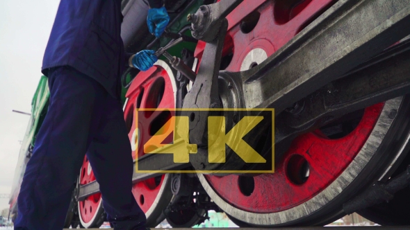 Concept of Manual Labor and Maintenance. Steam Locomotive Before Departure