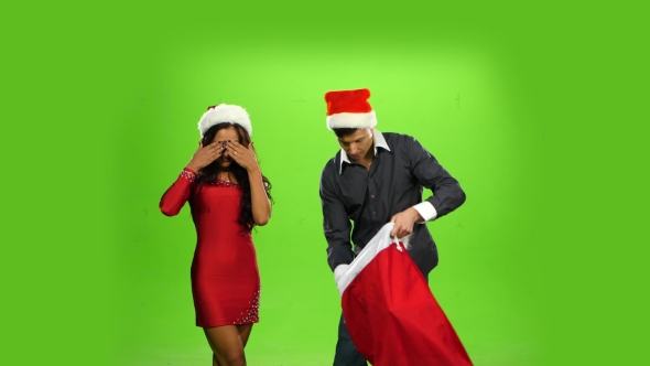 Beautiful Happy Christmas Holiday Couple, Gift Box Present. Green Screen alt