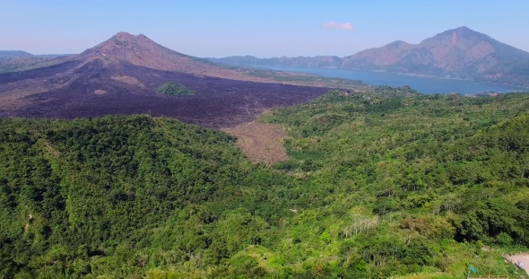 Aerial Footage of Gunung Batur Volcano. Drone View of Road and Volcano.