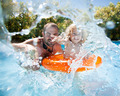 Child with father in swimming pool - PhotoDune Item for Sale