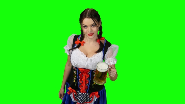 Girl in Bavarian Costume Celebrates Oktoberfest Beer Drinkers and Beckons. Green Screen alt