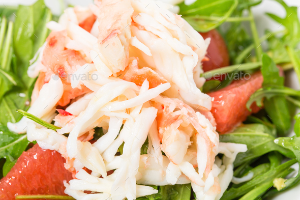 Snow crab salad with pomelo and arugula. Stock Photo by indigolotos