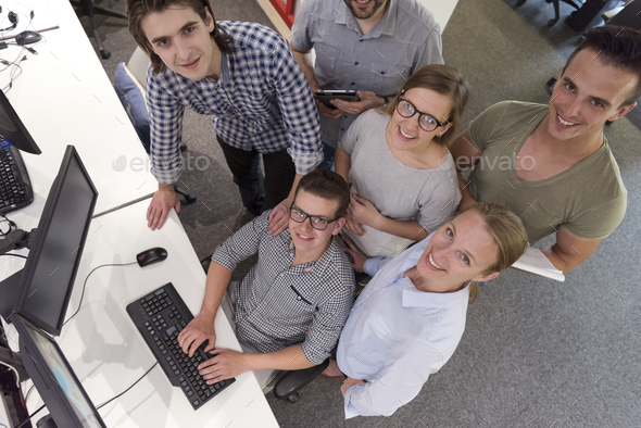 startup business people group working as team to find solution Stock Photo by dotshock
