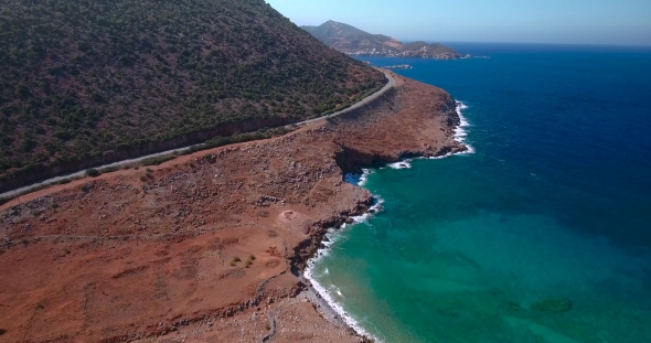 Flying Above Road By Seashore