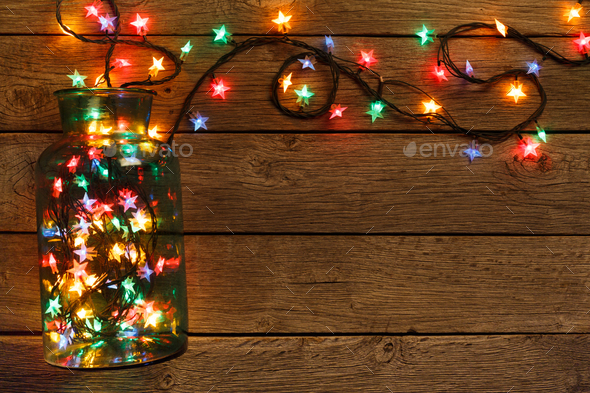 christmas lights border on wood background Stock Photo by Prostock-studio