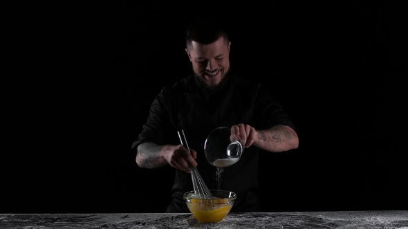 Chef Mixes the Eggs with the Sugar Black Background