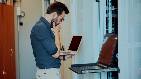 Technician Testing Network Connection. Hardware Updates On Server Room. System Administrator. alt