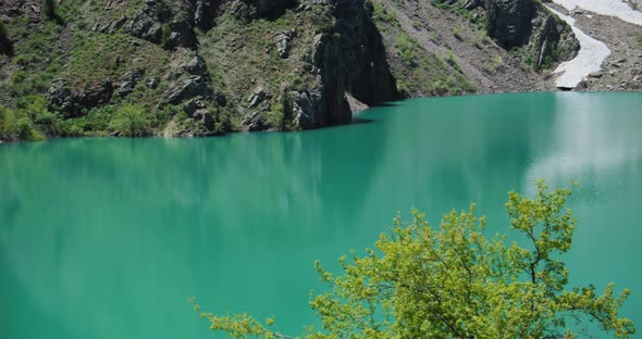 Mountain Lake of green and blue color Urungach. Located in Uzbekistan, Central Asia. 5 out of 10 alt