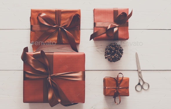 Top view of christmas present boxes on white wood background - Stock Photo - Images