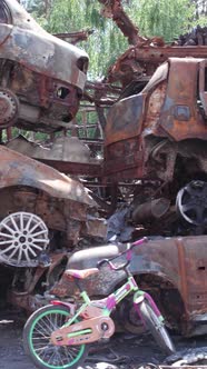 Vertical Video of Burnt Cars During the War in Ukraine alt