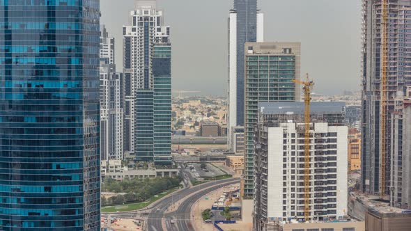 Dubai Business Bay Towers at Day Time Aerial Timelapse alt