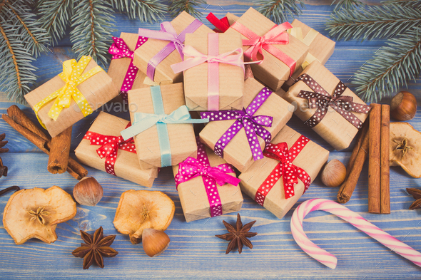 Vintage photo, Wrapped gifts with ribbons for Christmas, spices and spruce branches - Stock Photo - Images
