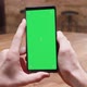 POV Shot of Male Hands Holding a Phone with Green Screen - VideoHive Item for Sale