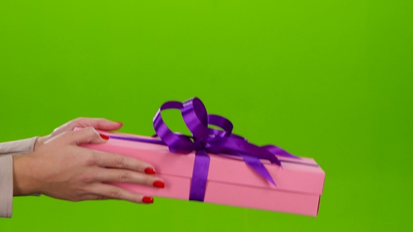 Gift of Not Small Size Shows in the Hands of Woman alt