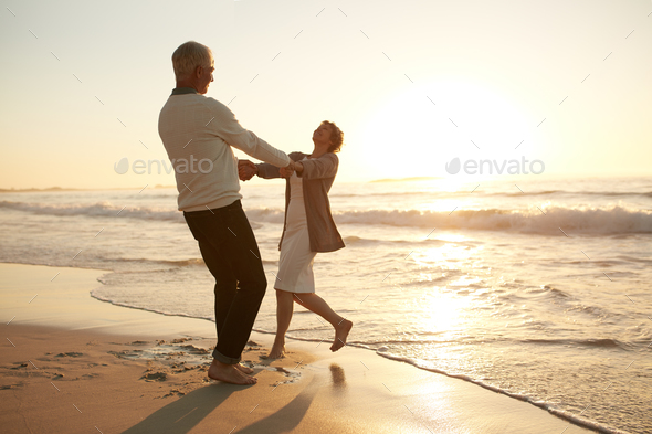 Romantic senior couple enjoying a day at the beach