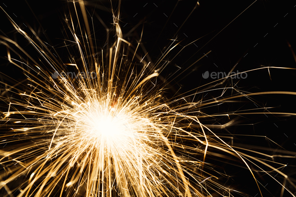 New year party sparkler closeup on black background - Stock Photo - Images