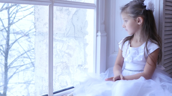 Sad Child Looking the Window, Snowing Landscape