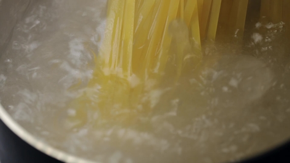 Spaghetti Is Cooked in Boiling Water in a Metal Pan