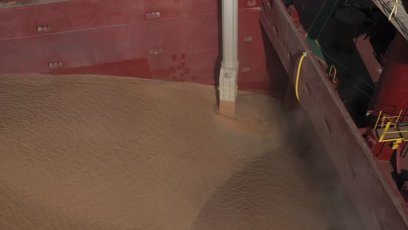 Loading Grain Onto a Cargo Ship for Sea Transport Using a Conveyor Loader
