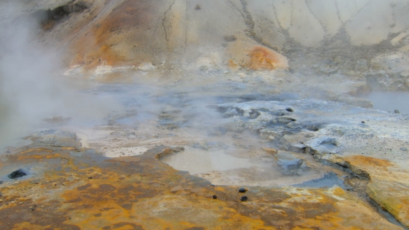 Boiling Mud Pots of Geothermal Area Krysuvik in Iceland, Ground Is Colored in Bright Colors