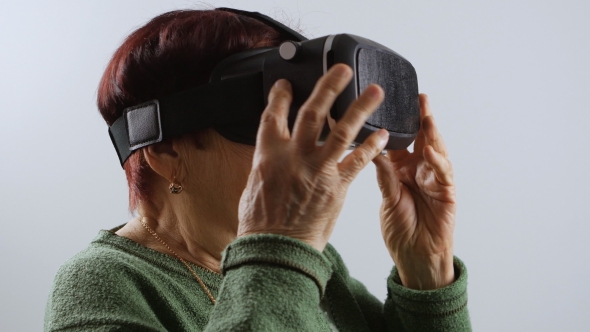 of Very Old Woman Using Virtual Reality Headset, VR Mask alt