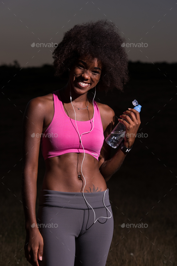 african american woman jogging in nature