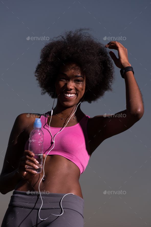 african american woman jogging in nature