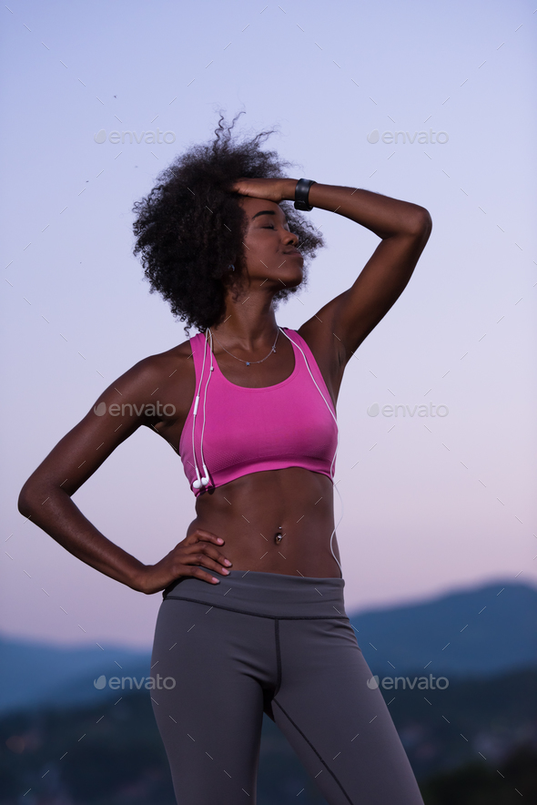 portrait of african american woman jogging in nature