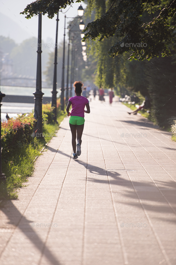 african american woman jogging in the city Stock Photo by dotshock