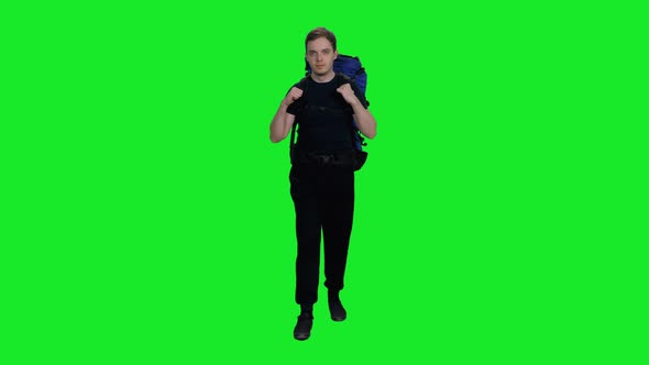 Young Hiker with Backpack Going to Camping against Green Screen Background