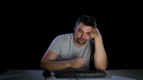 Man Was Tired and Fell Asleep in Front of a Computer Monitor alt