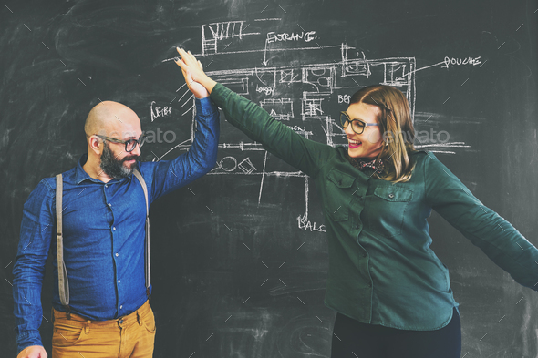 Architect team sketching new project on chalkboard. - Stock Photo - Images