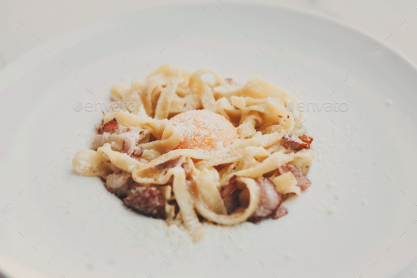Traditional italian pasta carbonara with bacon and egg - Stock Photo - Images