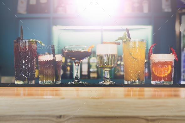 Creative alcohol cocktails in night club bar - Stock Photo - Images