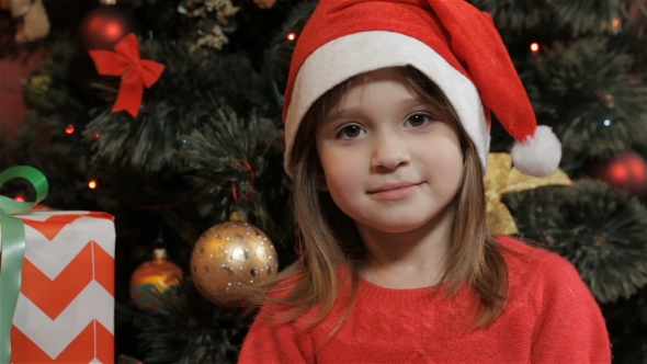 Little Girl Poses in Santa's Hat, Stock Footage | VideoHive