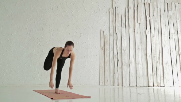 Woman Practicing Yoga - Ardha Baddha Padma Padangusthasana - Balancing on Toes