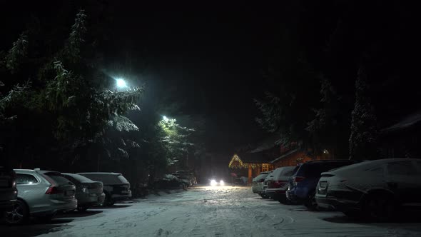 Cars Parked Near Nice Cottage in the Forest Winter Tourism Christmas Time alt