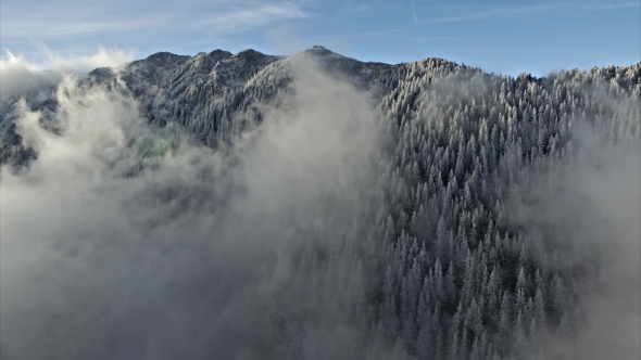 Aerial Drone Flying Over Clouds and Mountains