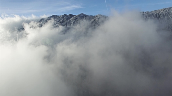 Aerial Drone Flying Through Clouds