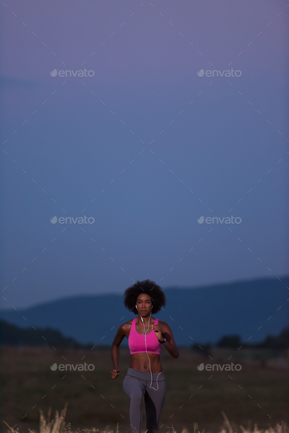 Young African american woman jogging in nature