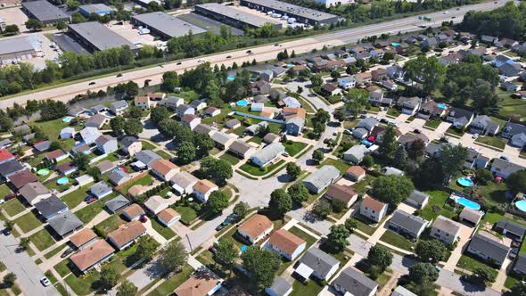 Aerial View of Town Along the River with Residential Areas of Private Houses alt